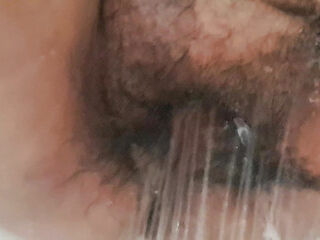 Stepmother dribbling water into her labia washing it