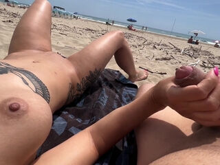 Beach hj and fingering makes depraved duo jizm in public