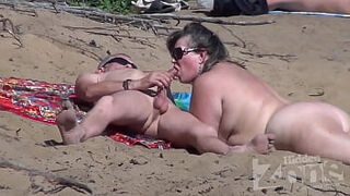 Blowjob on a naturist beach