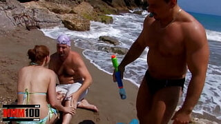 Cute gal gets boned on the beach in a supreme threesome