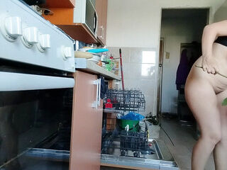 Sexy naked wifey prepping food in the kitchen. Hairy black-haired hair, massive ass, massive tits.